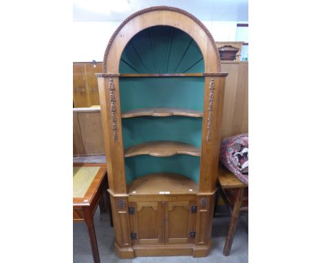 A George III style pine architectural corner cupboard 