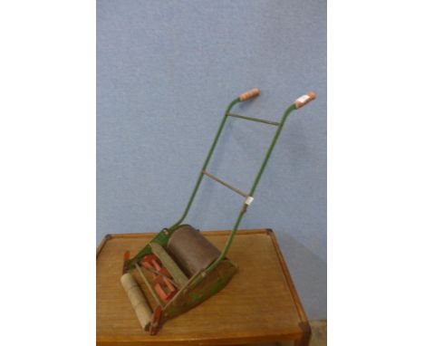 A vintage child's Webb green metal lawnmower 
