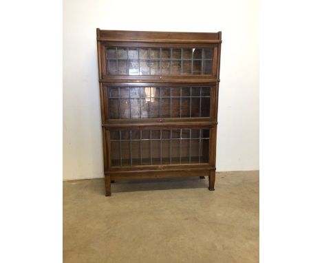 Globe Wernike three section library bookcase with leaded glass. W:87cm x D:29cm x H:121cm