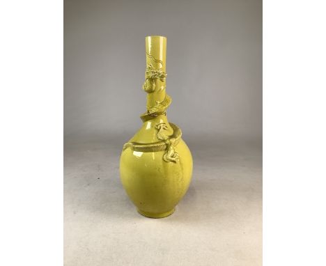 A late 19th to early 20th century Oriental yellow ceramic dragon vase. Staple repair to neck .W:22cm x D:22cm x H:46cm