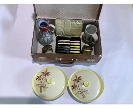 A mid century Crown Clarence tureen dish with vintage suitcase, two German pottery items, two clocks and cased knives.