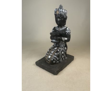 A kneeling Buddha composite statue with white paint detailing and holding a bowl with a felt top. W:21cm x D:27.5cm x H:46.5c