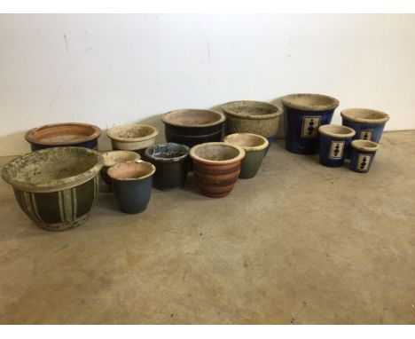 A large quantity of ceramic and glazed garden pots.
