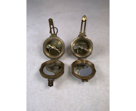 A pocket brass compass stamped Stanley together with one similar.