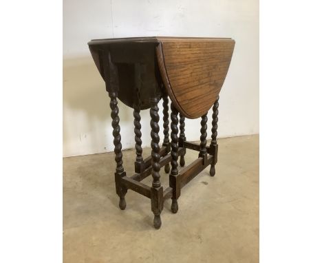 A small oak barley twist gate leg table.W:63cm x D:33cm x H:72cmExtends to W:88cm x D:63cm x H:72cm