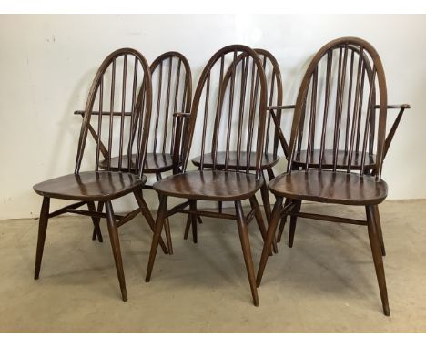 A set of six Ercol mid century stick back chairs. W:62cm x D:41cm x H:96cm