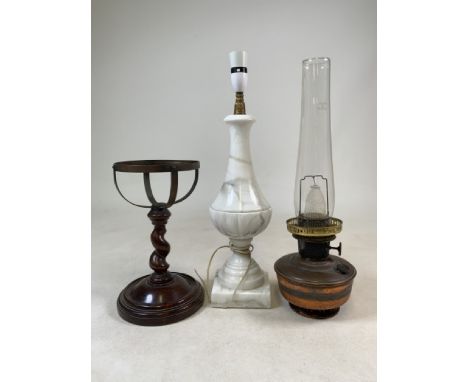 A solid marble table lamp, a copper oil lamp with chimney also with a turned mahogany stand.Marble  W:12cm x D:12cm x H:43cm