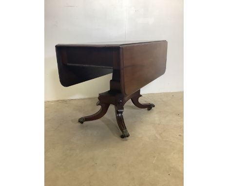 A Georgian mahogany sofa table, drawers either side, pedestal base to metal feet and castors. W:93cm x D:55cm x H:70cmextends