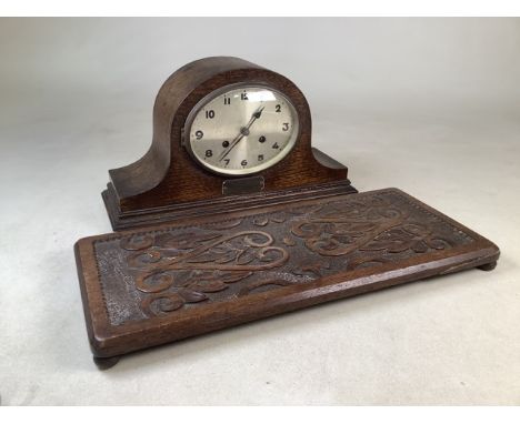 An oak mantle clock also with a carved oak tray.Tray W:50cm x D:22cm.