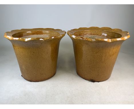 A Pair of glazed ceramic planters.W:45cm x D:45cm x H:35cm
