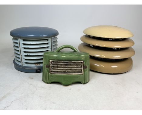 Two early 20th Century Art Deco H.M.V room heaters and a small ceramic cased heaters to include a cream beehive example.