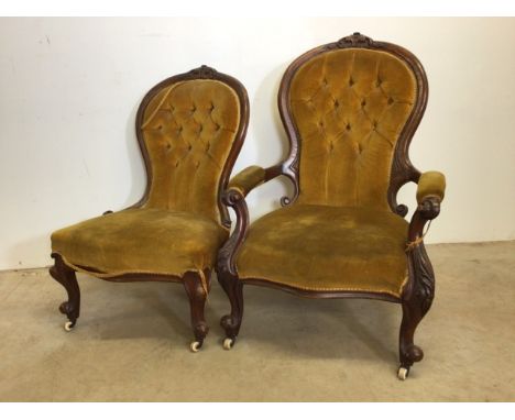 Victorian ladies and gentlemans upholstered button back chairs with scrolled and carved arms on ceramic castors. W:70cm x D:7
