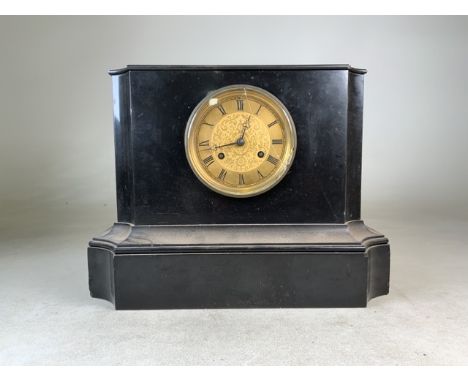 A slate eight day mantle clock. W:38.5cm x D:20cm x H:29cm