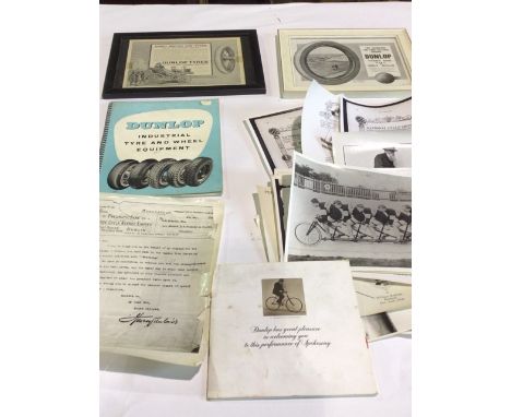 A collection of Dunlop ephemera to include 2 framed prints, photographs and manual