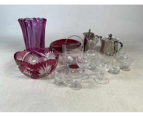 An assortment of glassware to include cranberry glass vase and bowl. A selection of wine and liquor glasses plus Royal Worces