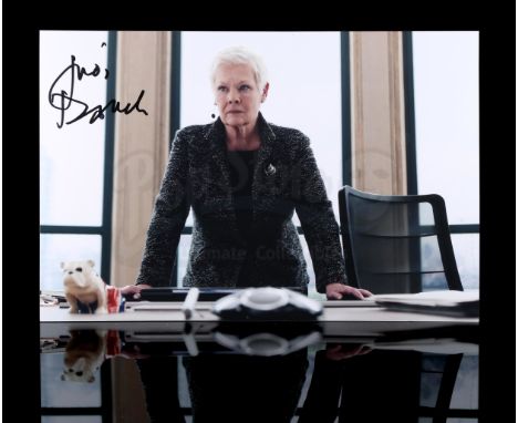 - A still of M played by Judi Dench from Sam Mendes' 2012 Bond Film Skyfall. The photograph has been autographed by Dench in 