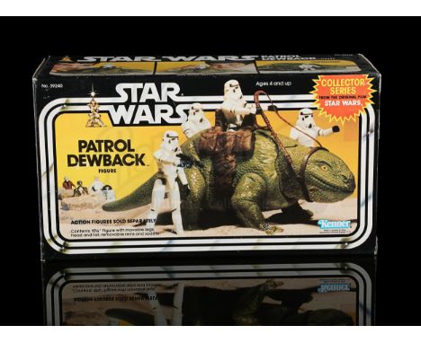 KENNER - Opened. Contents include cardboard insert with poseable Dewback and collections booklet. Partially removed Kay-Bee r