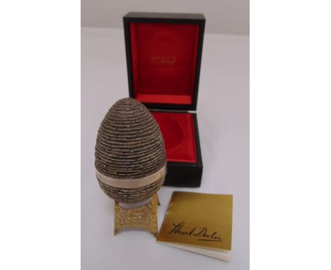 Stuart Devlin limited edition no 243 silver egg in fitted case with silver filigree stand to include COA