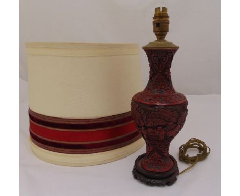 A Chinese cinnabar lacquer table lamp on circular hardwood base to include shade, 36cm (h)