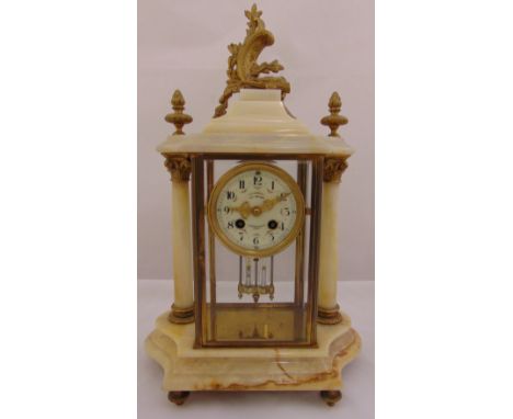 A French 19th century mantle clock, the brass mounted marble case supporting a circular enamel dial with Arabic numerals and 