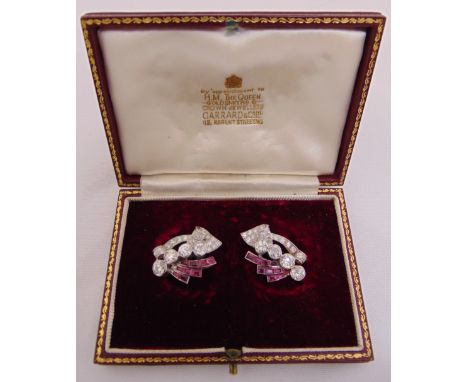 A pair of diamond and ruby earrings set in white gold tested 18ct, retailed by Garrards in original presentation box, approx 