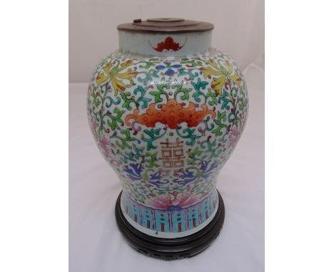 A Chinese 19th century lamp base, baluster form decorated with bats, flowers and leaves on turned hardwood stand 41cm (h)