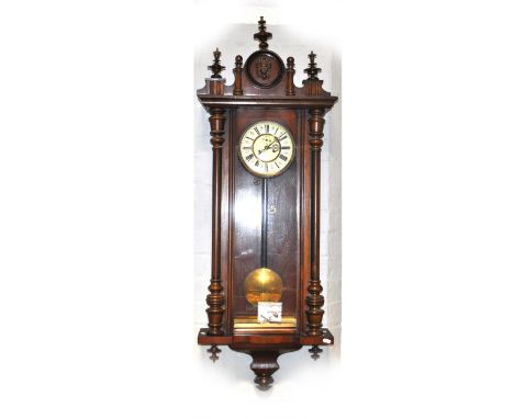 A walnut and beech Vienna wall clock, ivorine chapter ring, with subsidiary second dial, double-weight driven movement, heigh