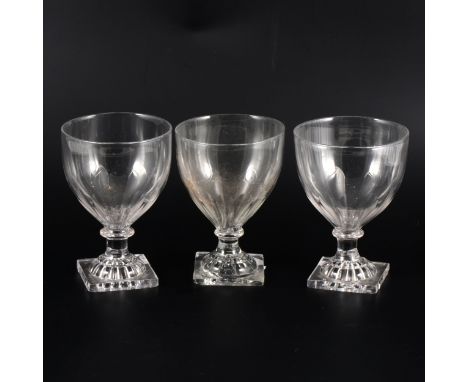 Three similar George III rummers, lemon squeezer bases, facet-cut bodies, approx 13.5cm high. (Qty: 3)