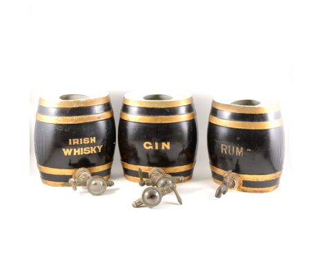 Three pottery barrels with optics, Irish Whisky, Rum and Gin, each 27cm high. (Qty: 3)