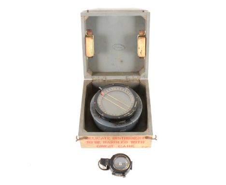 A Spitfire P8 boxed compass No. 1465.D and a J M Glauser London marching compass dated 1937, No. B 1628 MKIX in a leather cas