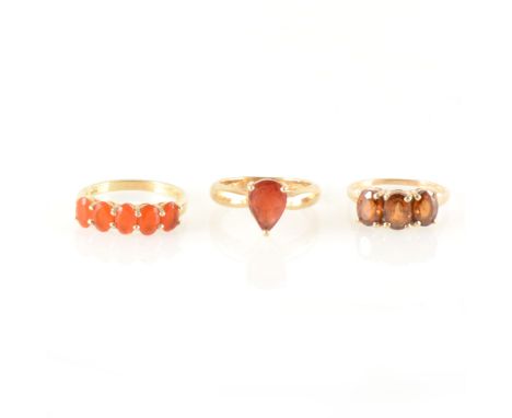 Three gemstone dress rings, zircon, fire opal andesine, a 9 carat all yellow gold ring claw set with three cognac zircon, rin