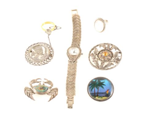 A collection of silver and white metal jewellery, brooches, pendants, rings, collectables, a hallmarked silver fabric lined c