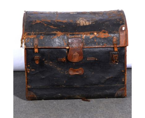 A canvas bound dome-top trunk, 77cm; and leather suitcases.
