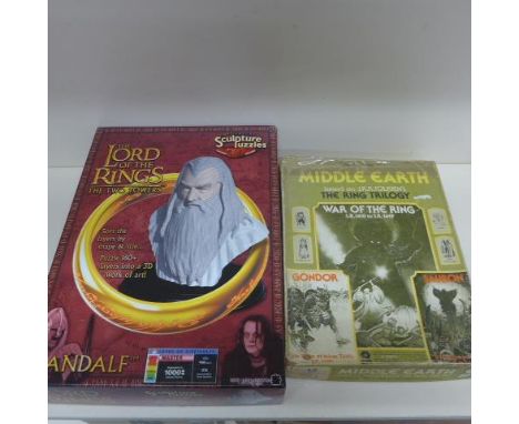 A boxed Lord of the Rings The Two Towers Gandalf Sculpture puzzle and a vintage 1977 SPI Three Game set War of the Ring Games