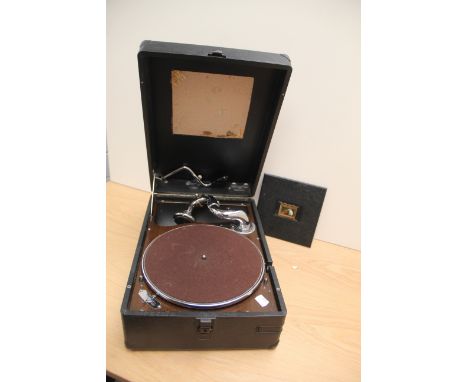 A vintage gramophone with a number of old shellac 78's in case - jazz related