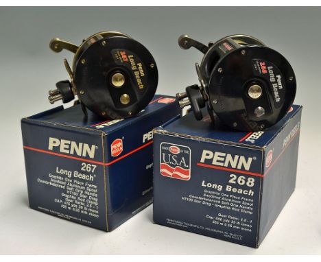 2x Penn Long Beach Bait Casting Sea Reels - unused 267 and 268 (with line) models with one piece graphite frame, multi-disc s