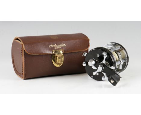 Fine Abu Ambassador 6000c level wind multiplier - black end plates, foot stamped 037100 in makers original brown leather reel