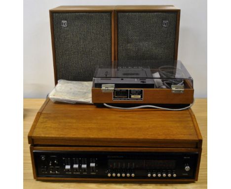 A 1970s Dynatron teak cased record player and cassette recorder with speakers and original instructions.