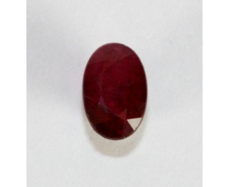 An oval cut light red ruby, approx 0.77ct.