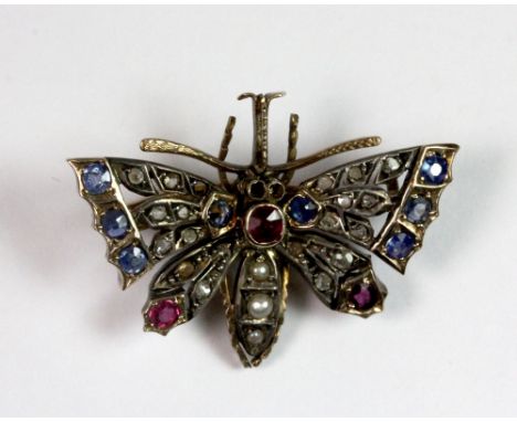 An antique yellow metal (tested min 9ct gold) diamond, sapphire and ruby butterfly brooch with removable bar allowing use as 