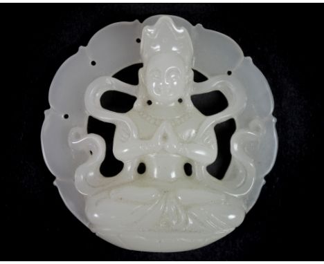 A very fine Chinese carved white jade amulet of a seated Tara, W. 5.5cm.