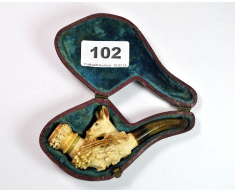 A cased early meerschaum pipe featuring a jade collar and one jade horn, L. 10cm.