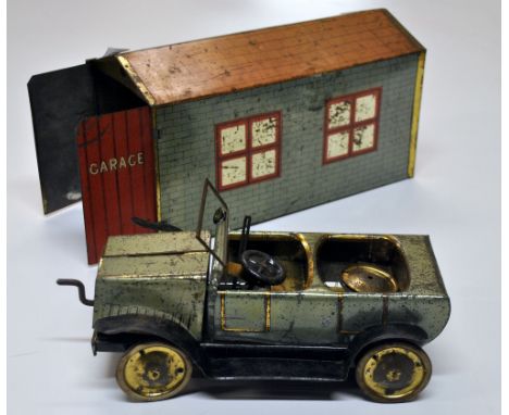A vintage tinplate clockwork motorcar and garage by Brenco (30 x 14 x 17cm).