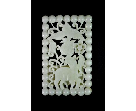 A Chinese carved pale celadon jade amulet, 5 x 8 x 0.5cm.