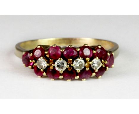 An 18ct yellow gold ruby and diamond cluster ring (Q.5).