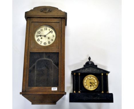 An Edwardian oak wall clock and a French slate mantle clock.