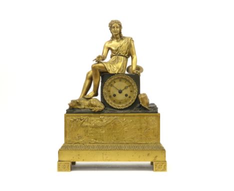 early 19th Cent. French clock in partially gilded bronze with a "Young man with dog" sculpture and a fine basrelief - with a 