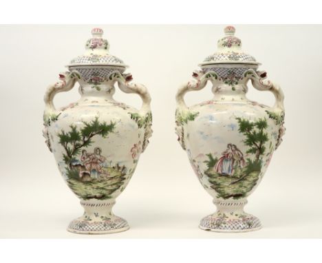 pair of 19th Cent. French "Manufacture de Robert (Marseille)" marked lidded vases in ceramic with polychrome painted decors -