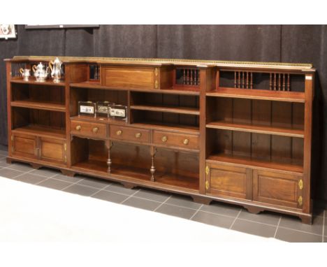 19th Cent. English library bookcase with a quite rare low model in mahogany with three drawers, five small doors and several 