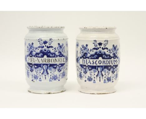 pair of 18th Cent. quite big pharmaceutical jars in ceramic from Delft with a blue-white decor||Paar achttiende eeuwse grote 